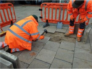 [photo] Workers fixing a pavement